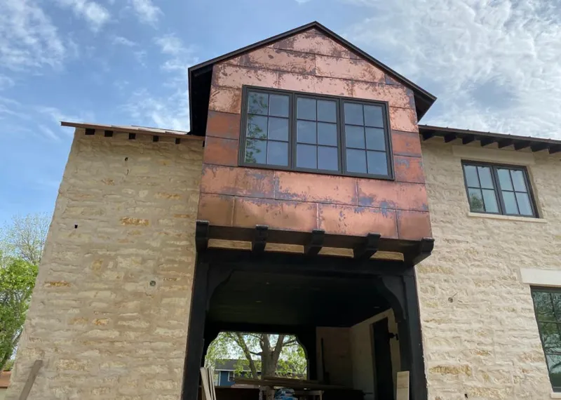 Copper metal panel facade on a stone building for Metal Roof Coating in Laughlin